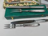 a knife, fork, and knife holder on a table