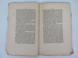 an open book on a table with a white background