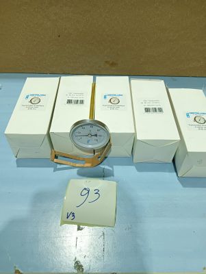 a clock that is sitting on a table next to some boxes