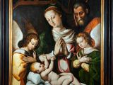 un tableau représentant une famille avec un bébé dans une crèche