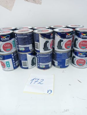 several cans of dog food are lined up on a table