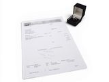 a receipt with a ring on it next to a ring box