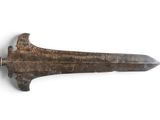 a close up of a very old knife on a white surface