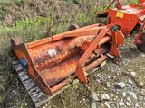 a tractor that is parked on the side of the road