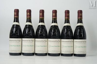 six bottles of wine are lined up in a row on a table