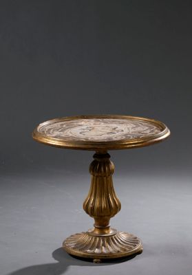 an image of a gold plate on a pedestal on a gray background