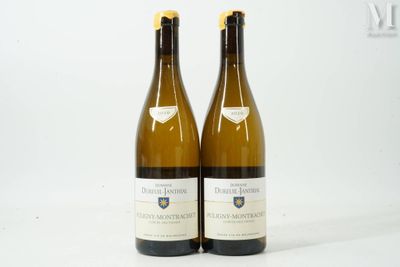 two bottles of white wine sitting next to each other on a white surface
