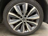 a close up view of a car ' s wheel and tire