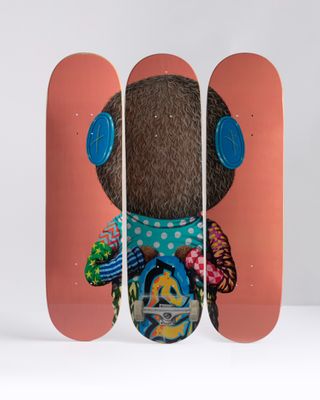 a skateboard with a picture of a teddy bear on it