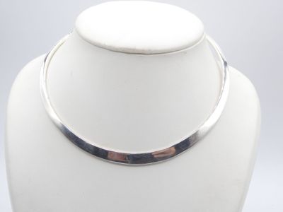 silver plated collar necklace on a white mannequin