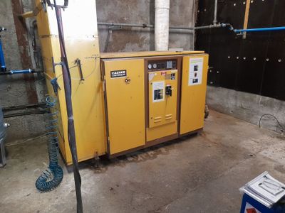 a yellow machine that is sitting in the middle of a room