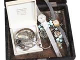 a black case with a bunch of jewelry inside of it