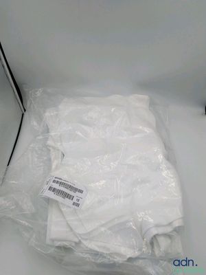 a white shirt wrapped in plastic on a white table