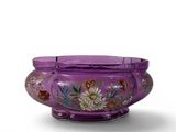 purple vase with flowers and butterflies painted on it on a white surface