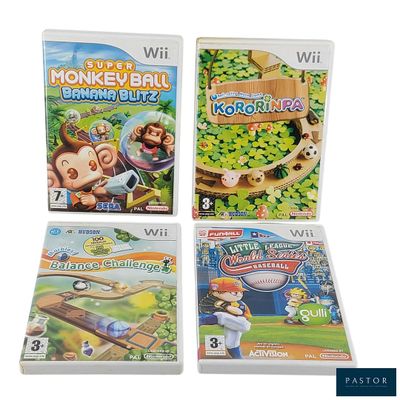 Trois jeux Nintendo Wii sont présentés sur une surface blanche