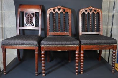 three chairs that are next to each other on the floor