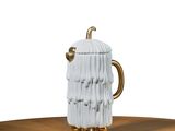 a white ceramic mug with a gold handle on a wooden table