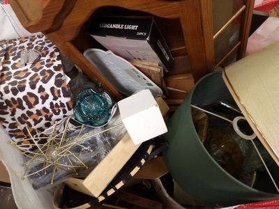 a pile of assorted items sitting on the floor