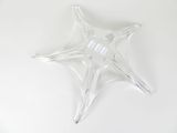 a clear star shaped object on a white surface