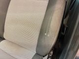 a dirty seat in the back of a car