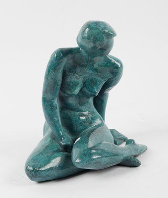 sculpture of a man sitting on his knees on a white background