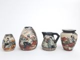 three vases with different designs on them on a white surface