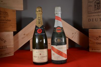 two bottles of wine sitting next to each other on a table