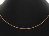 un collier à chaîne en or sur un mannequin mannequin mannequin mannequin mannequin mannequin mannequin mannequin mannequin mannequin