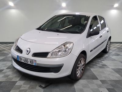 a picture of a white car parked in a garage
