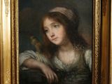 portrait of a young girl with a bird in a gilded frame