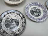 many plates that are sitting on a table