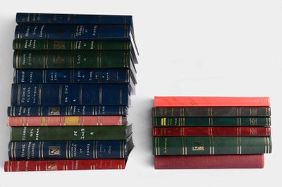 several books are stacked on top of each other on a table