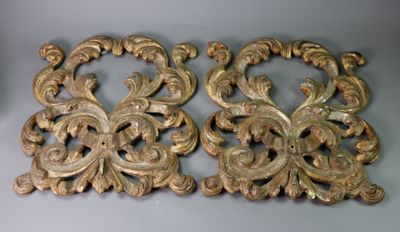 pair of antique carved wood wall hangings with scrolls and scrolls