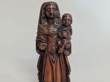 statue of a woman holding a child in her arms