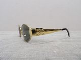 a close up of a pair of sunglasses on a white surface