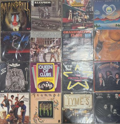 a lot of different album covers on the wall