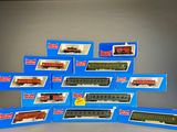 a lot of toy trains that are sitting on a table