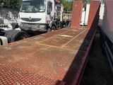 a truck that is parked next to another truck
