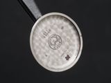 an image of a close up of a metal pan with a handle