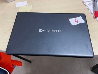 a laptop that is sitting on a desk in a room