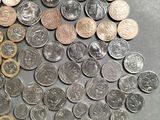 a lot of coins that are on the table