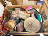 a cardboard box filled with assorted items on the floor