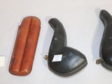 three different types of leather items on the table