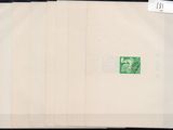 an old photo of a green stamp on a piece of paper