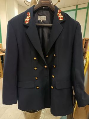 navy blue blazer with gold buttons on the lapel and gold buttons on the lapel and gold buttons on the lapel and gold buttons on the lapel