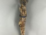 an image of a wooden sculpture of a person with a hat on it ' s head