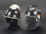 helmet and face shield on a mannequin head on a black background