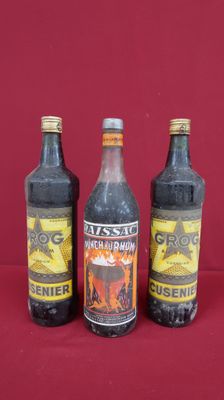 three bottles of beer are sitting on a red surface