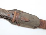 an old knife that is on a white surface