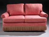 an image of a pink couch with fringes on it